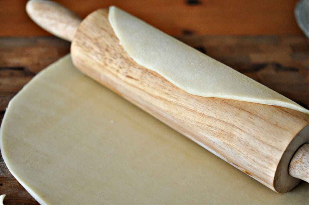 Roll out pie crust and transfer to the pie plate