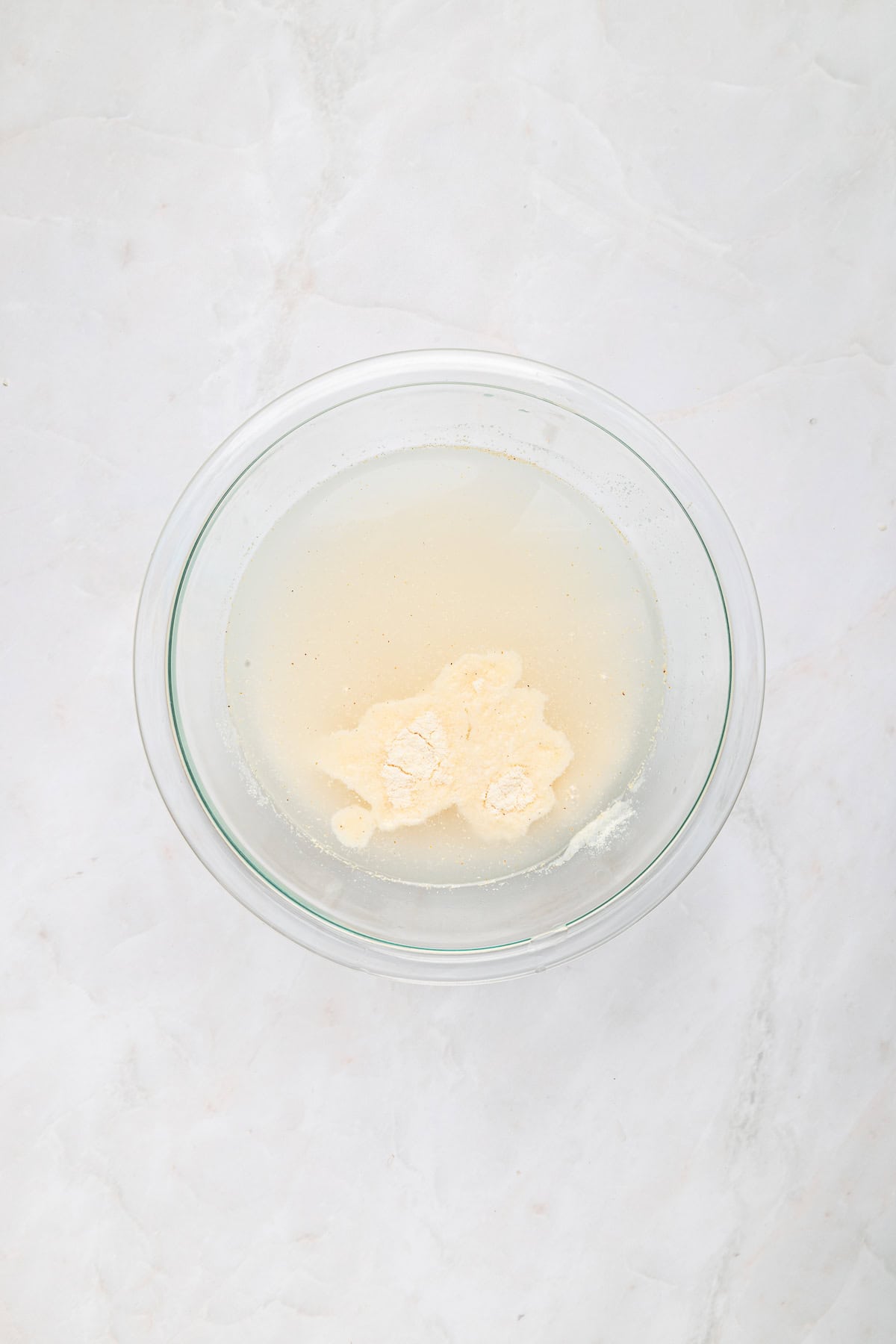 Incorporating corn flour into water.