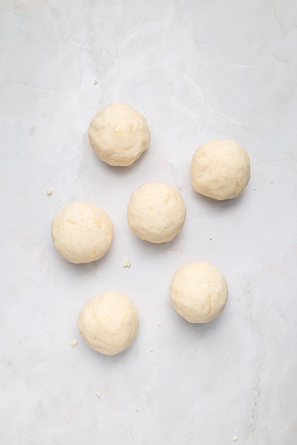 Six balls of arepa dough.