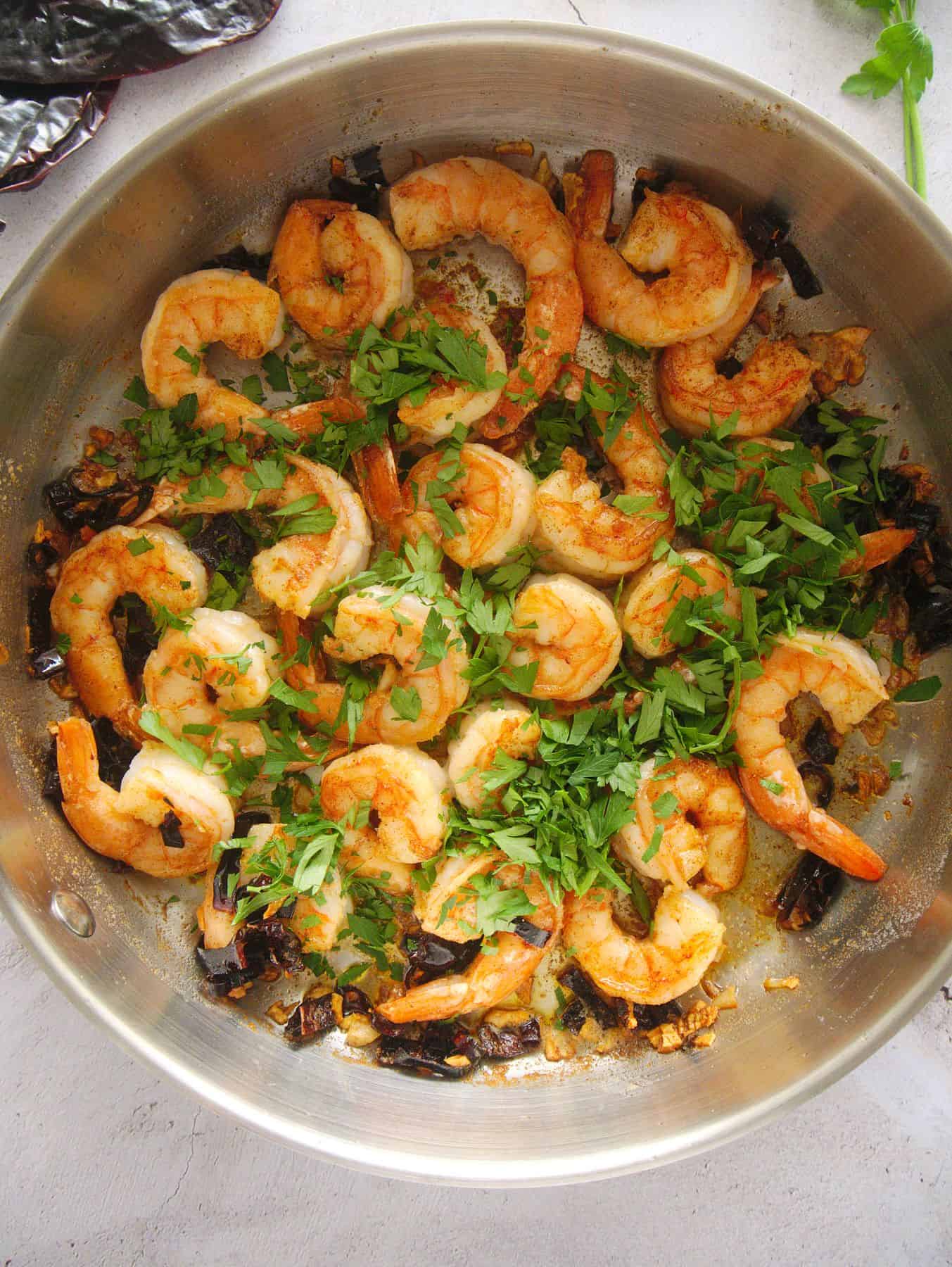 Adding fresh parsley.