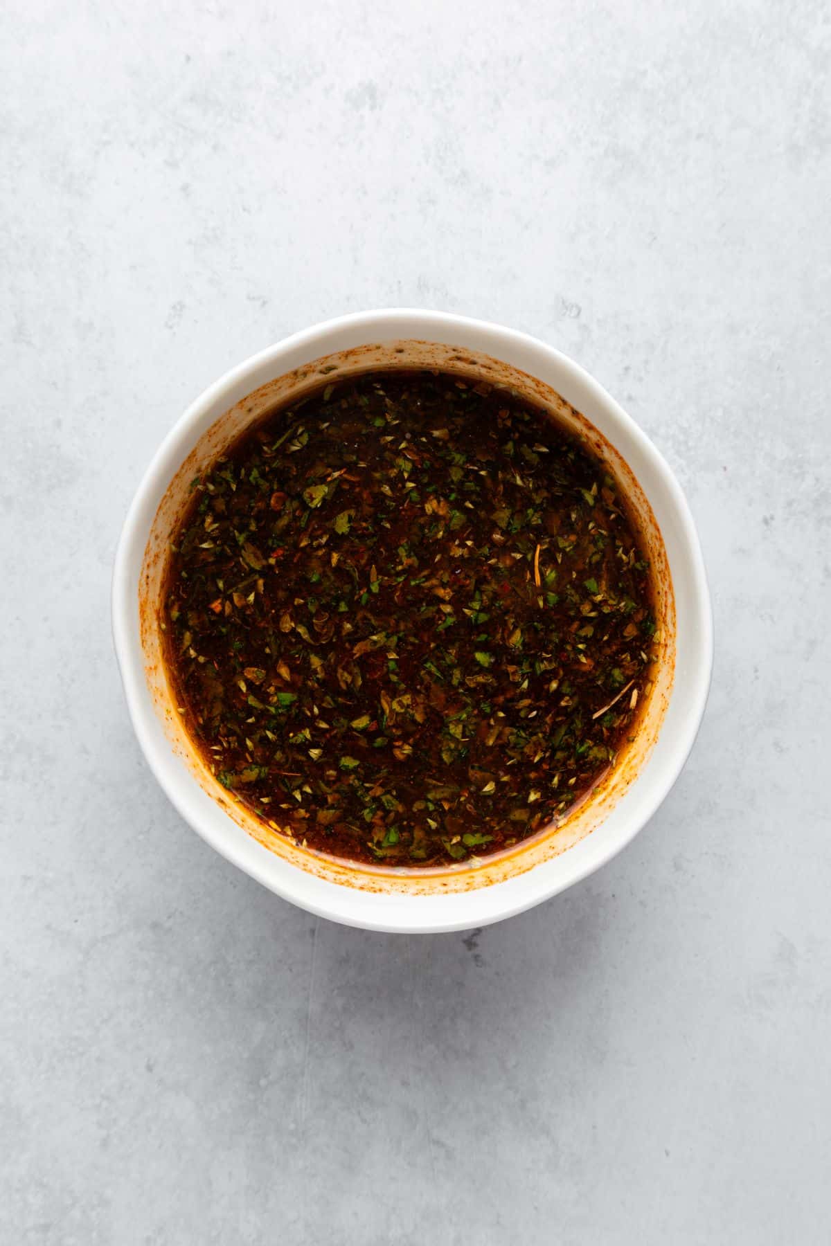 Chimichurri sauce in a small bowl.