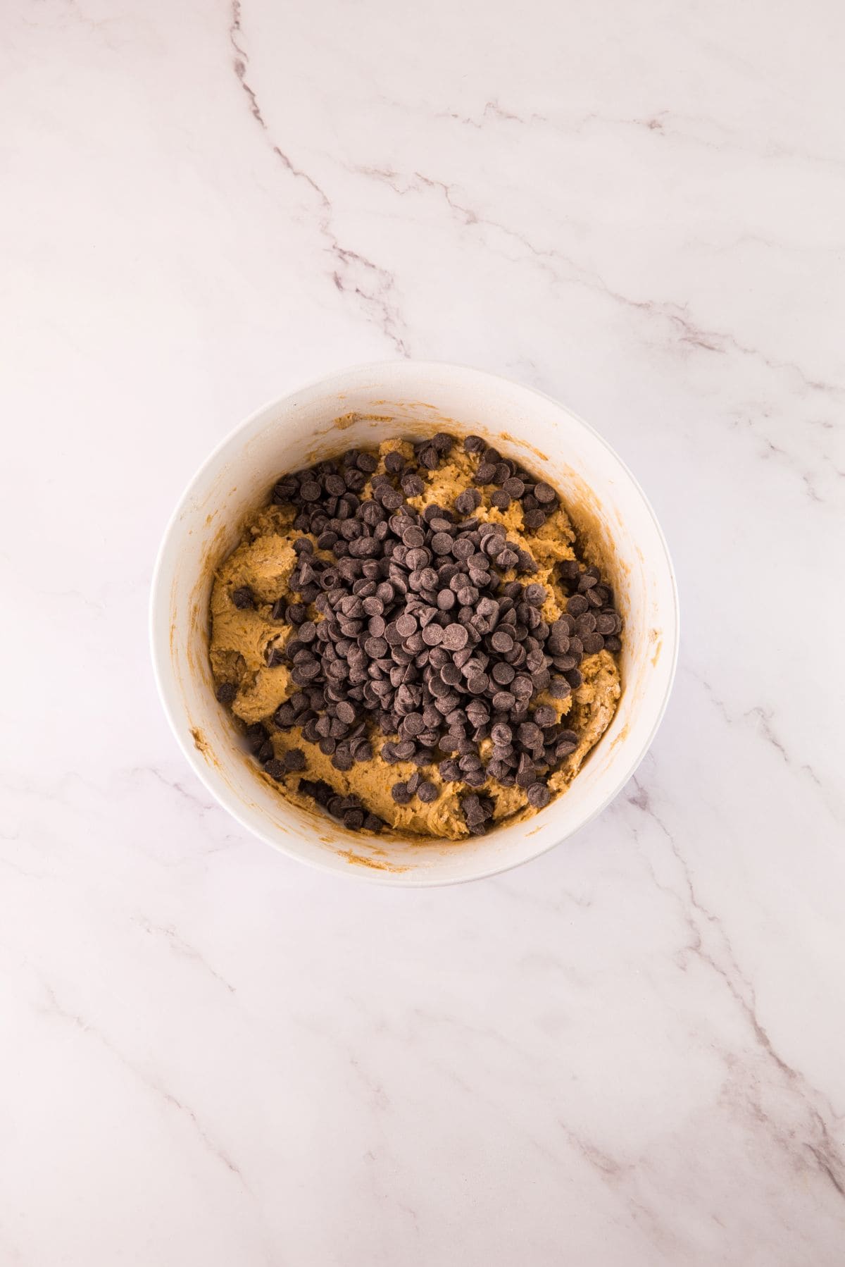 Folding in chocolate chips.