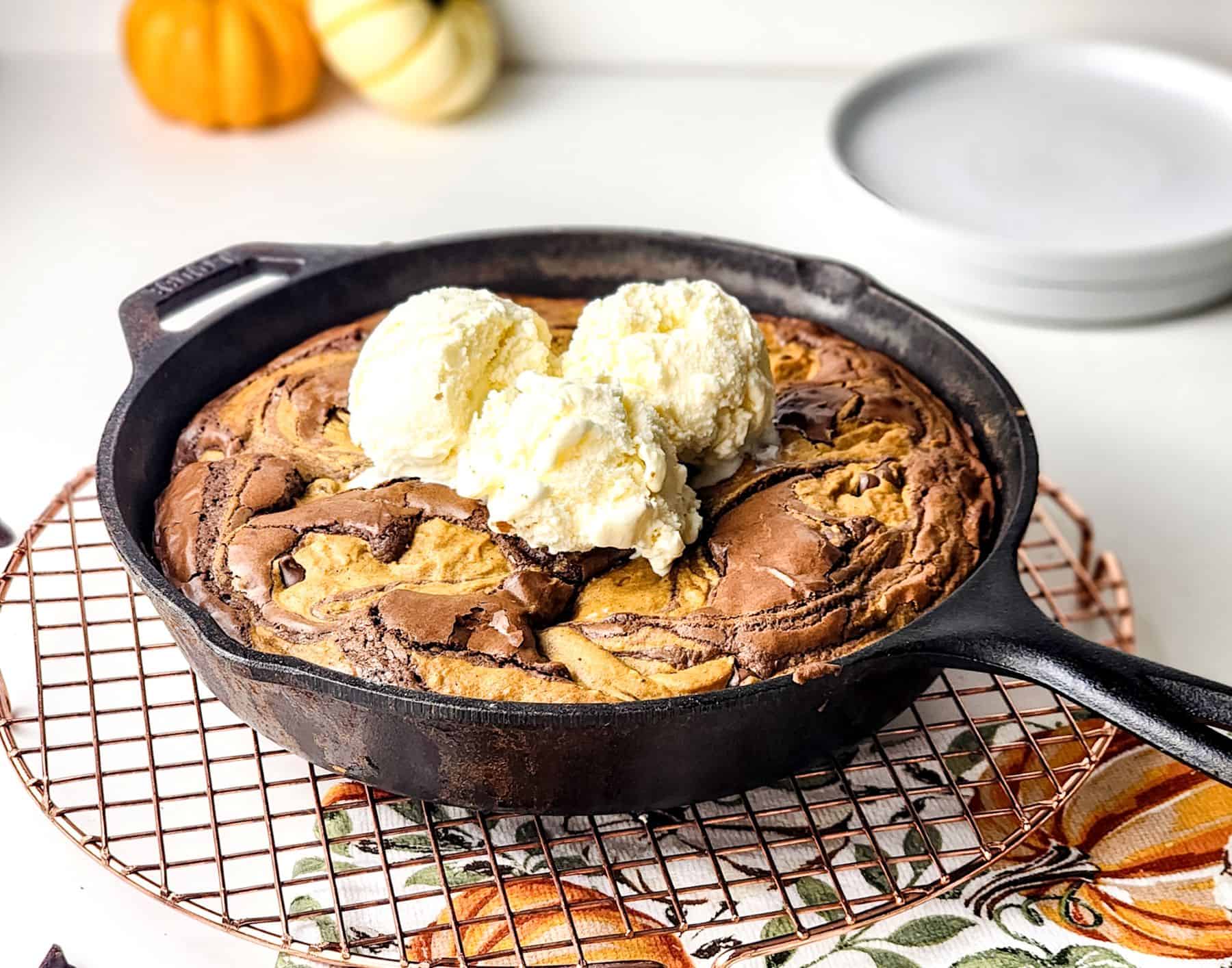 Pumpkin brownie skillet with ice cream on top.