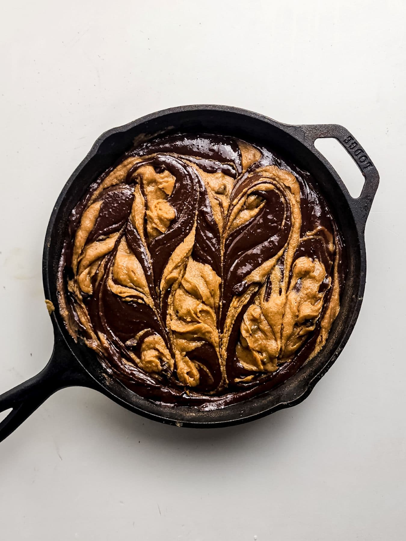 Making a swirl on the pumpkin brownie skillet.