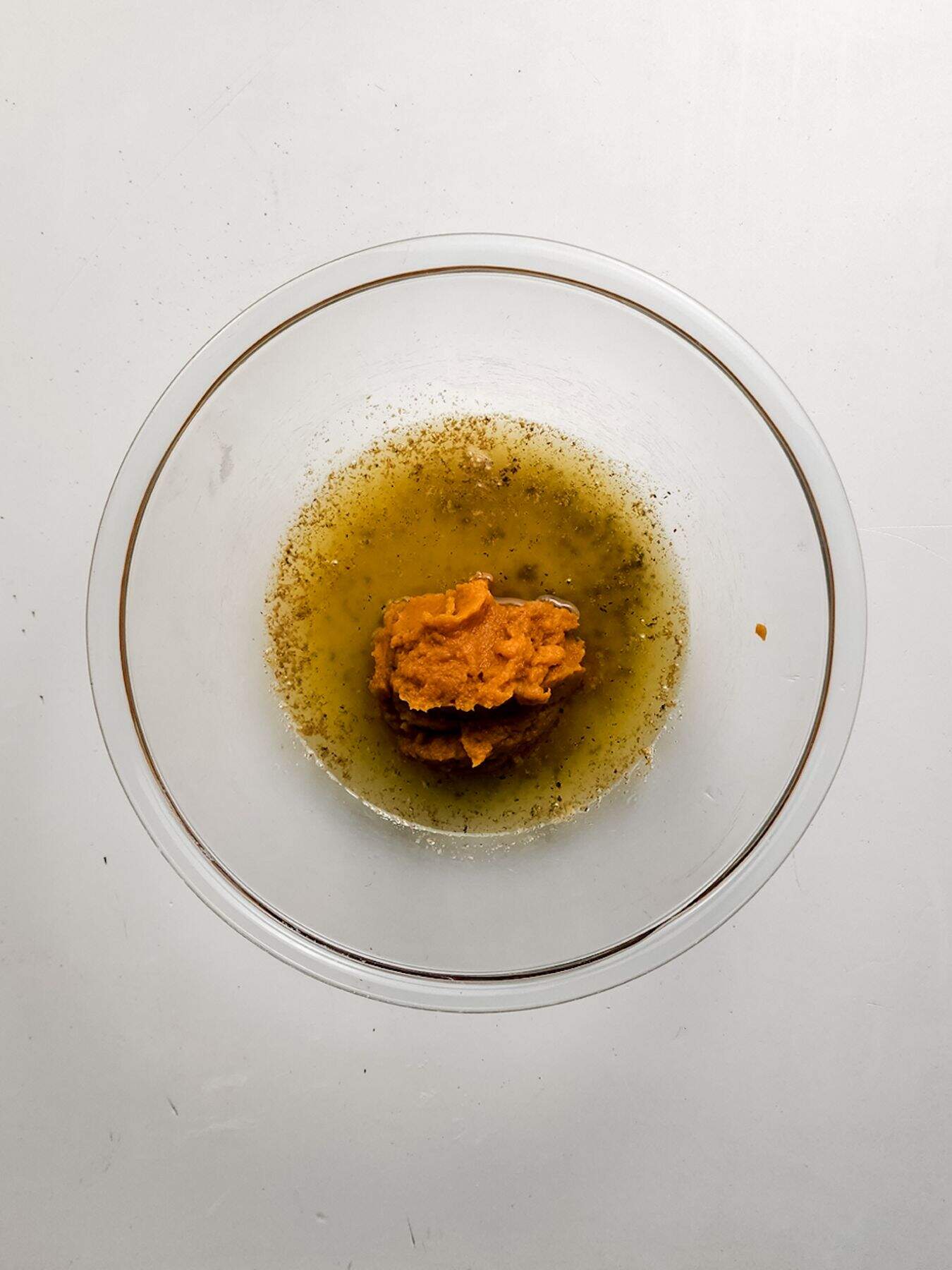 Mixing butter and pumpkin puree.