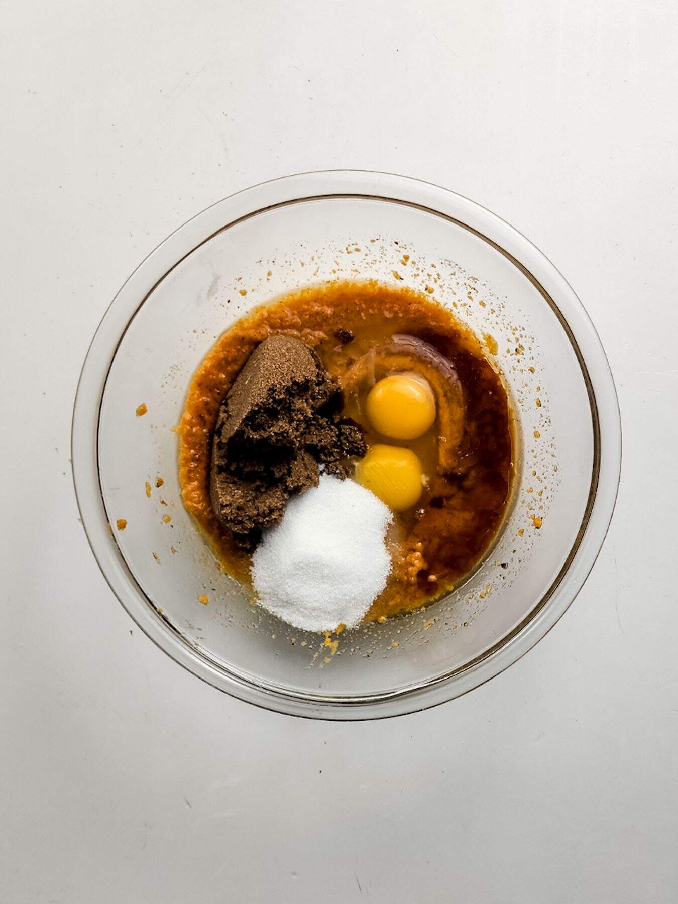 Incorporating sugar and eggs.