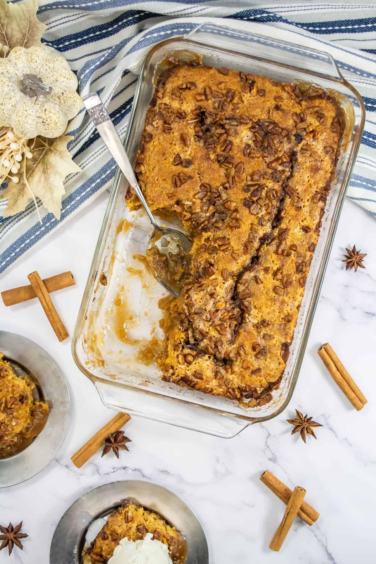 Pumpkin Cobbler with Pecan Topping in a baking dish.