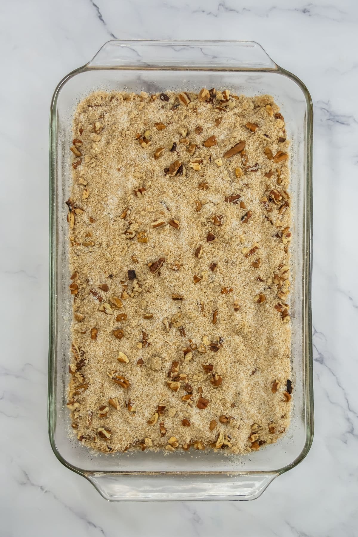 Pecan mixture on top of the pumpkin batter.