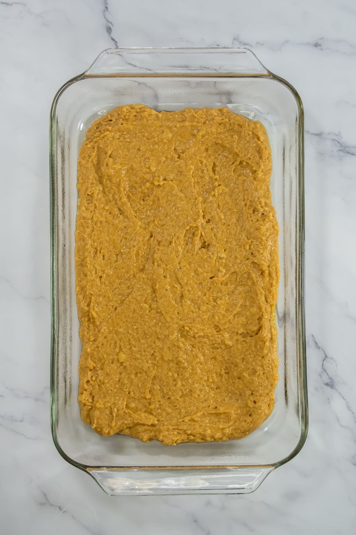 Pumpkin batter in a baking dish.