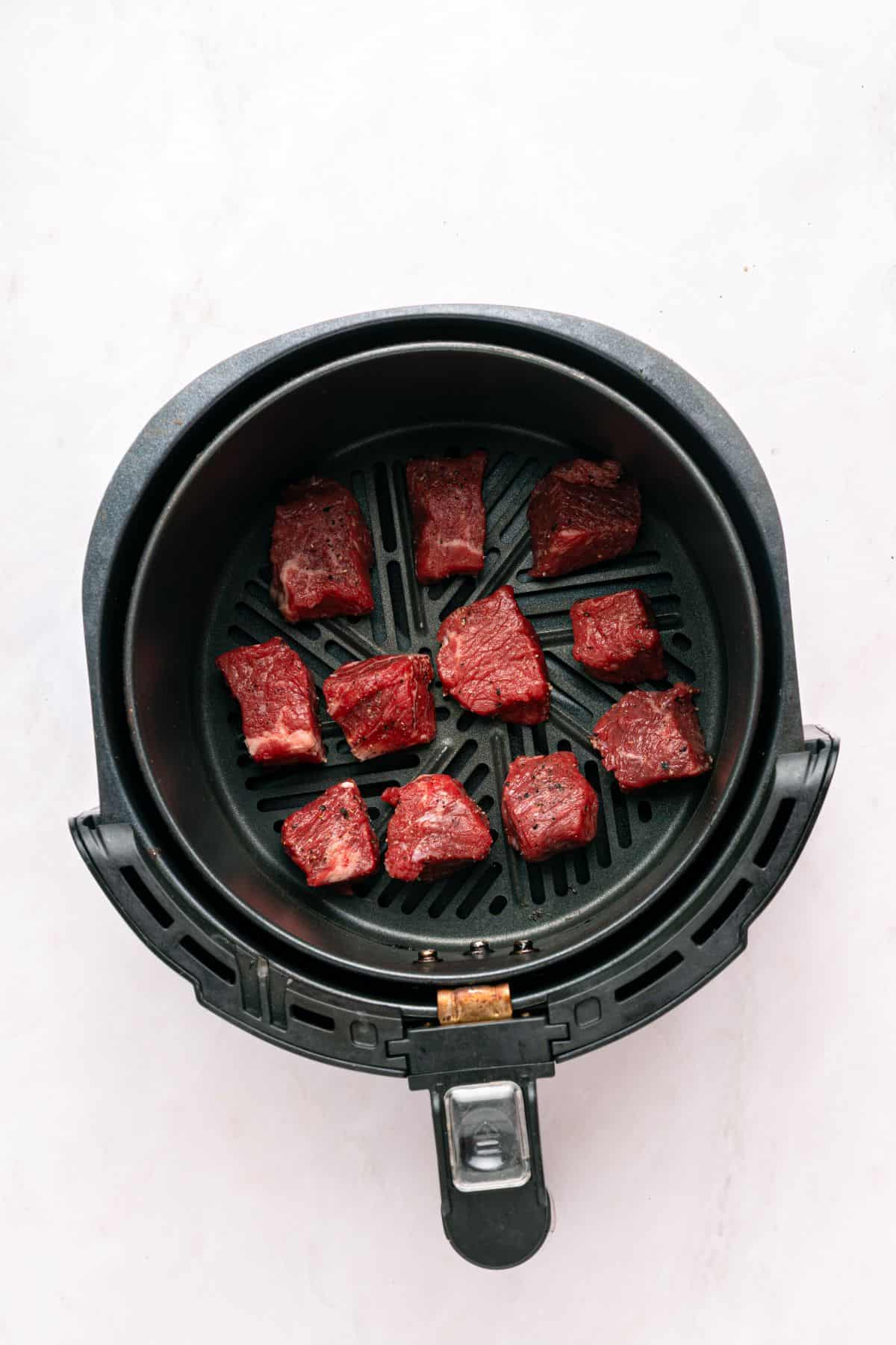 Cooking the steak bites.