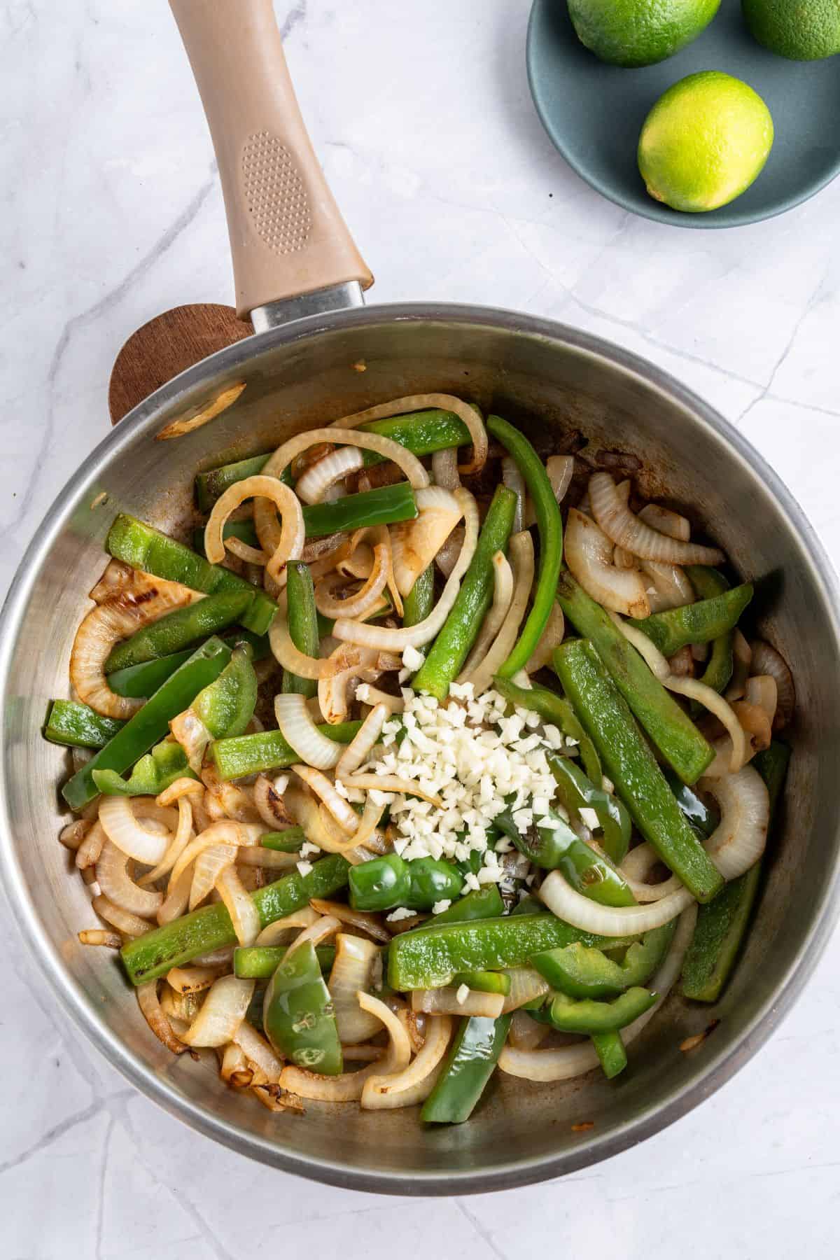 Adding minced garlic.