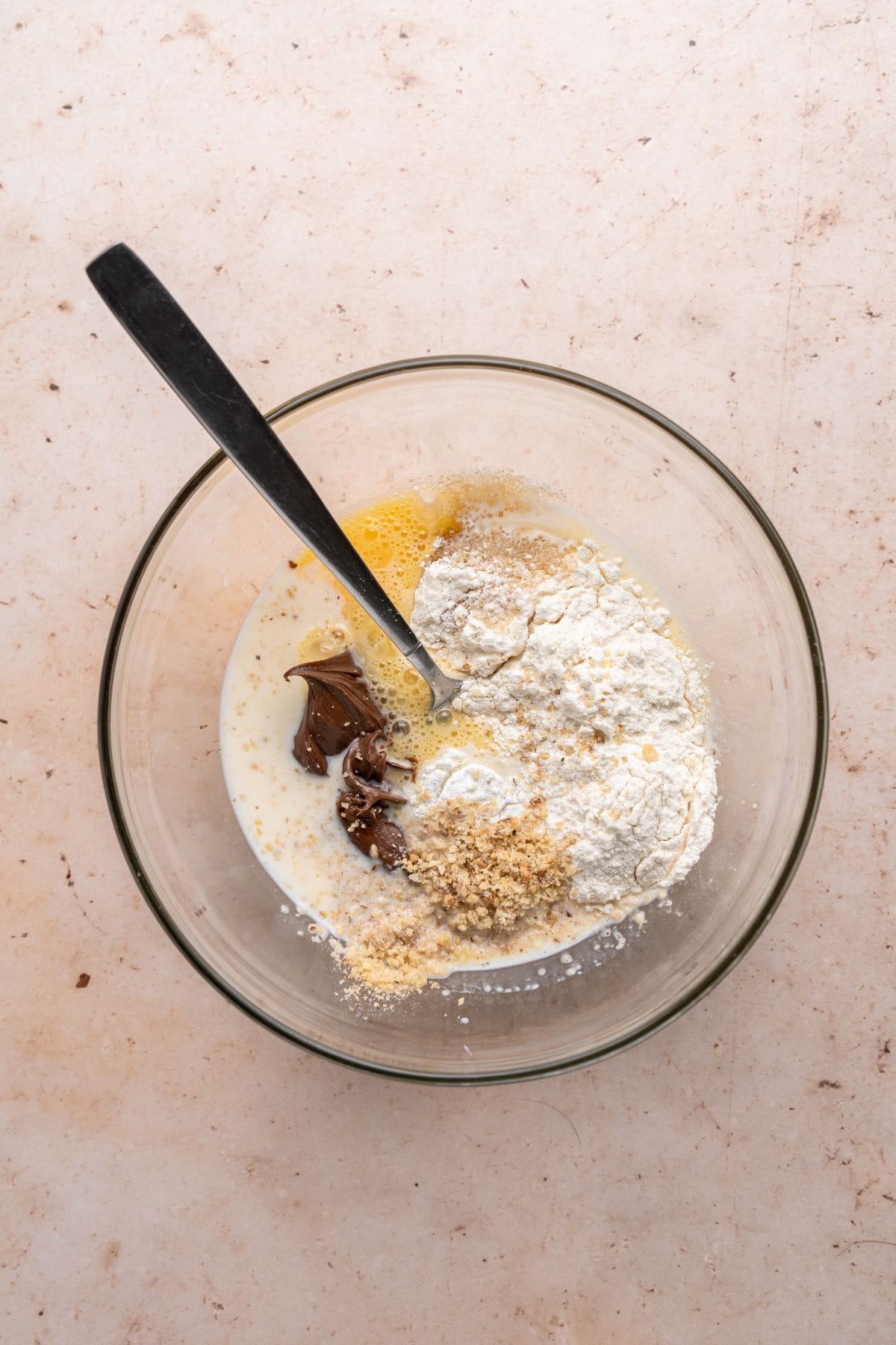 Mixing ingredients for the Nutella mug cake.