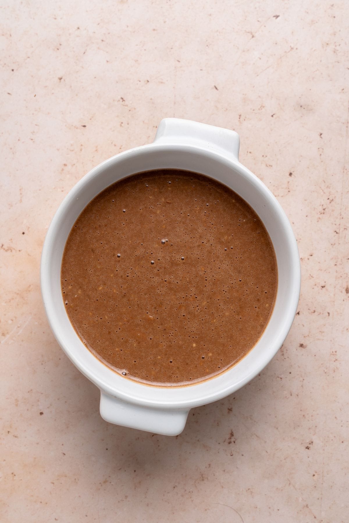 Nutella mug cake batter in a ramekin.