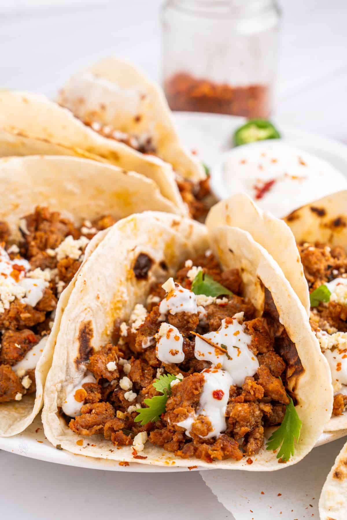 Chorizo tacos with toppings.