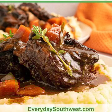 Short Ribs Recipe with Red Wine on a pile of mashed potatoes