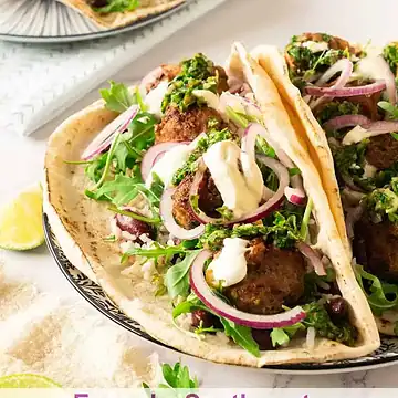 Chimichrri Meatball Tacos with red onion and crema