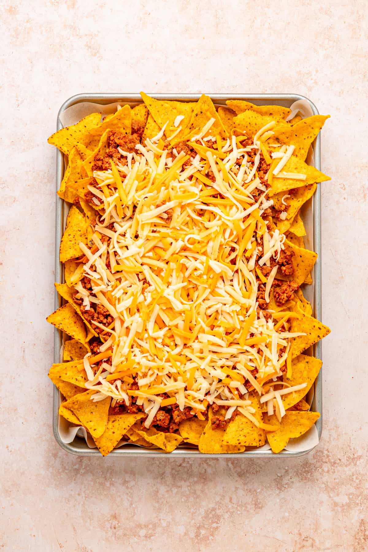 Shredded cheese is added on top.