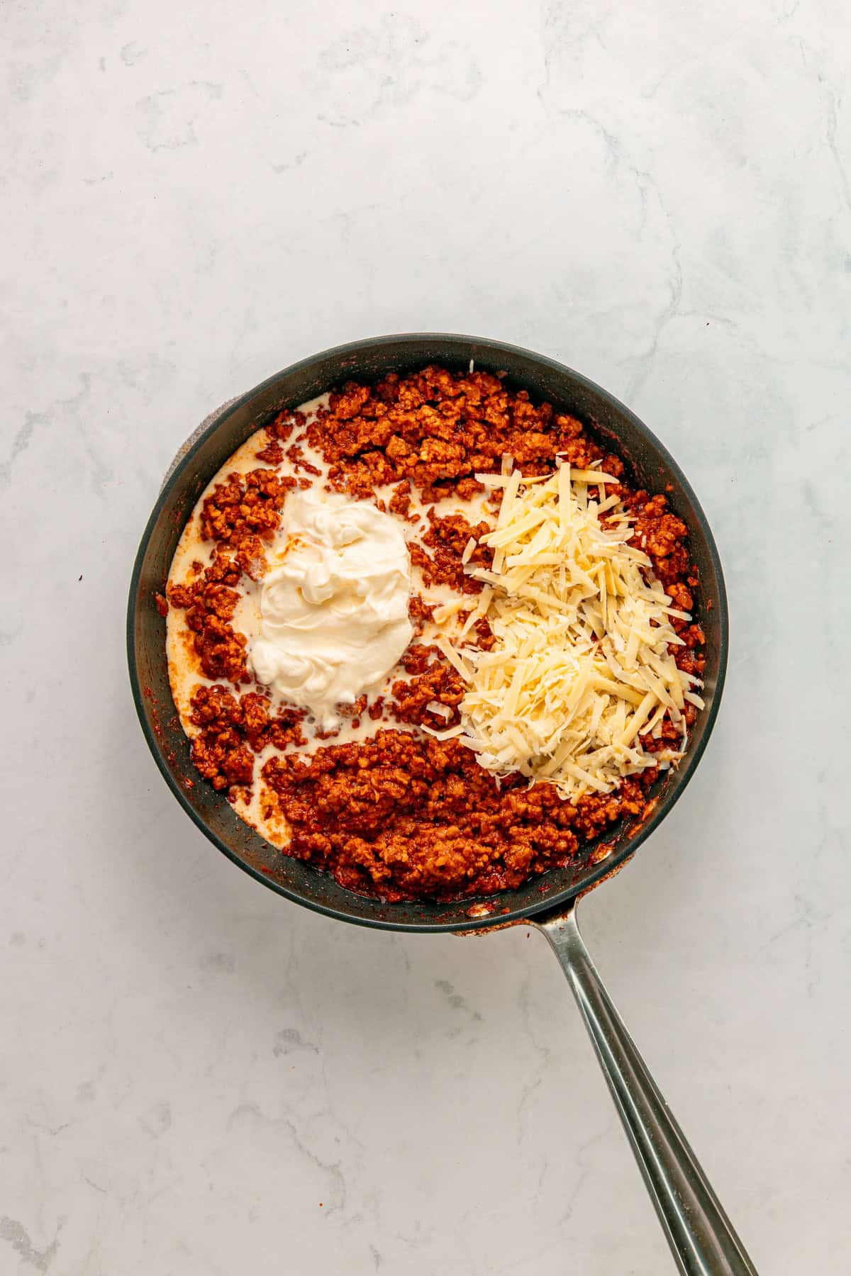 Incorporating heavy cream and parmesan cheese.