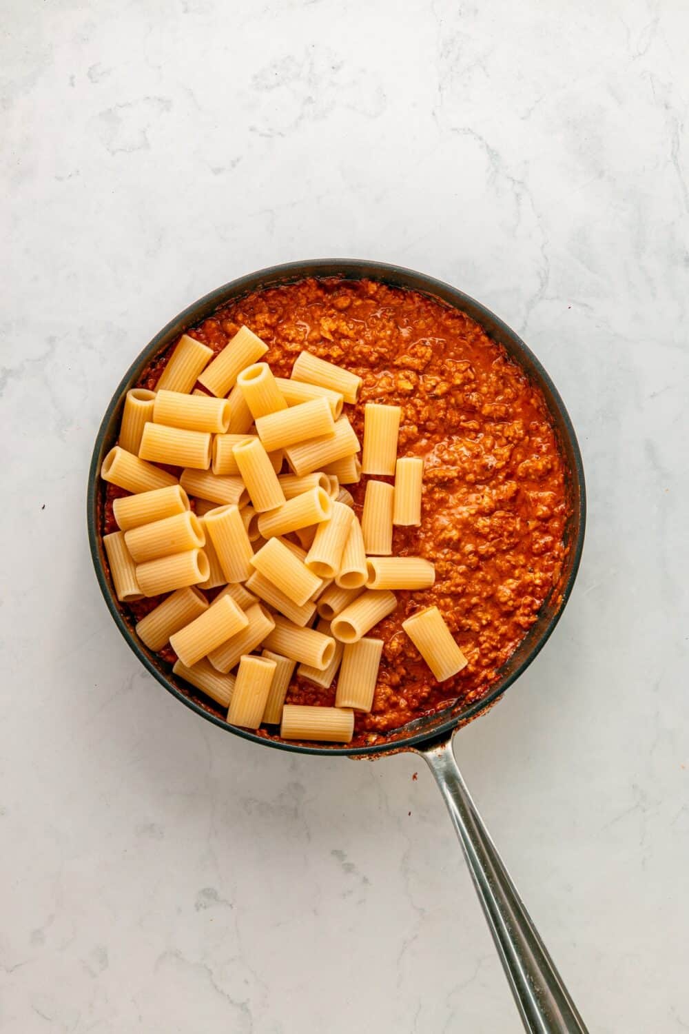 Toss in cooked rigatoni.