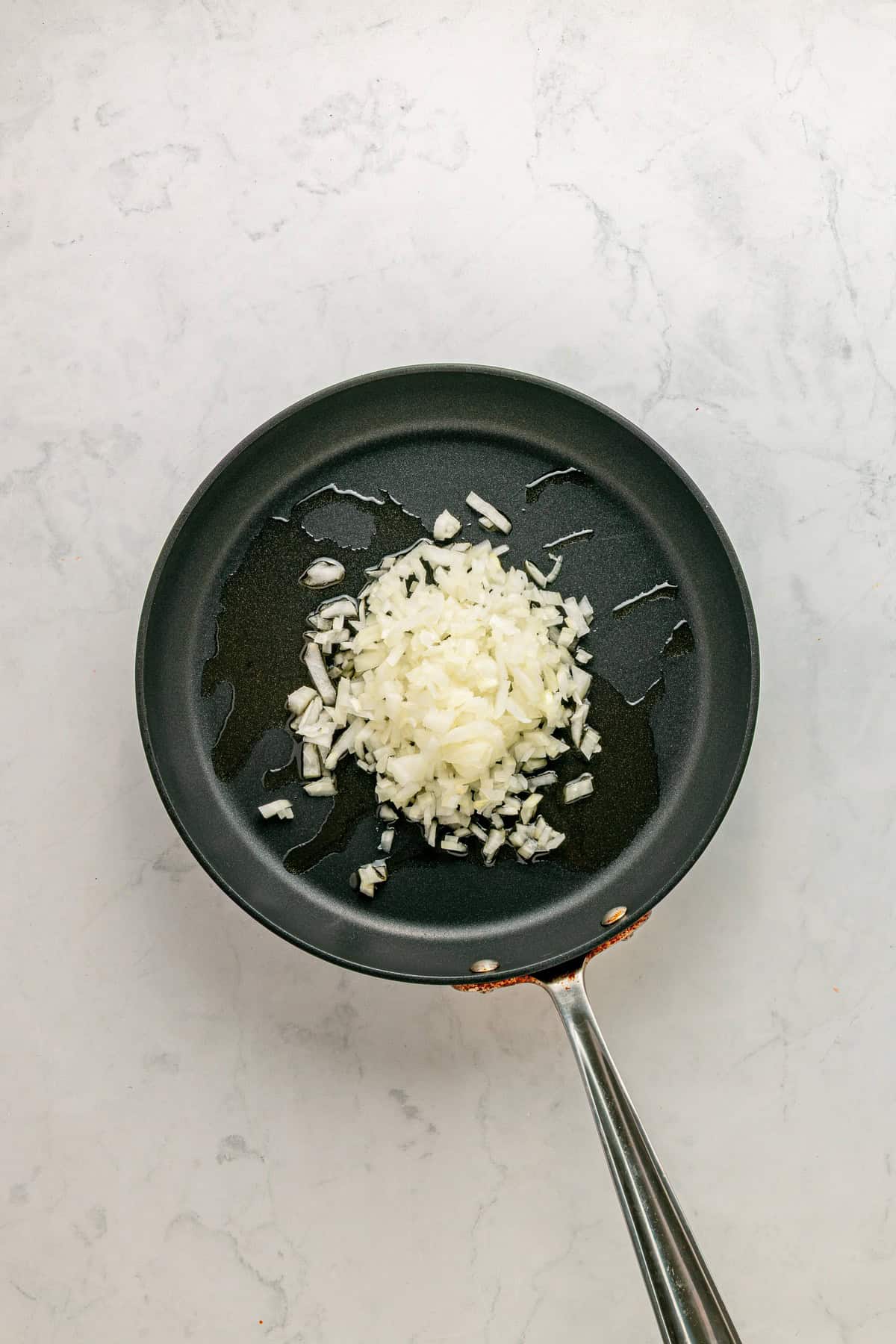 Sauteing the onion in olive oil.